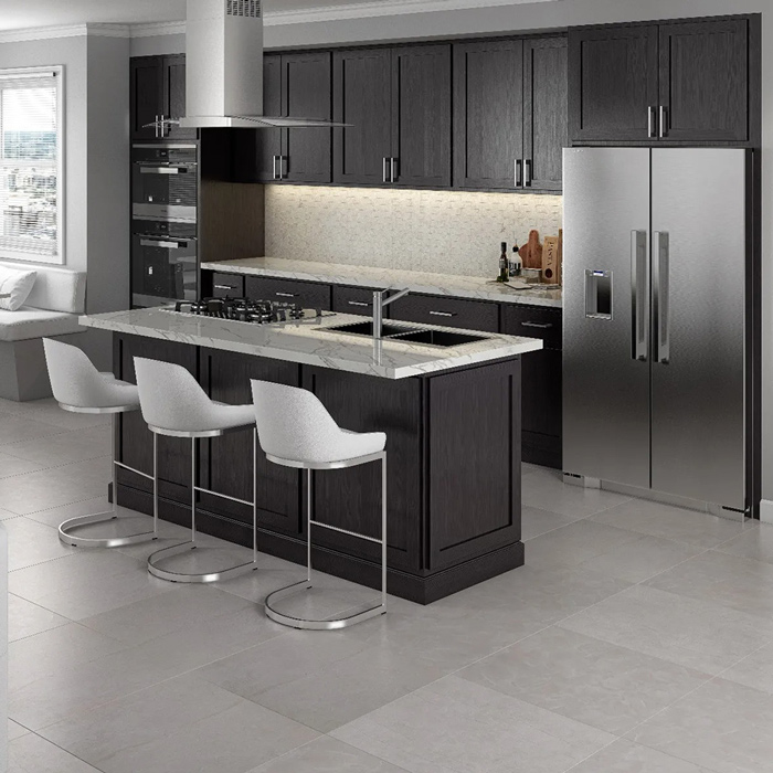 north-point Modern kitchen with dark cabinets, a large island with three stools, stainless steel fridge, and built-in appliances.